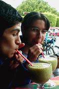 Nahum (left) and Beto sipping kiwi smoothies