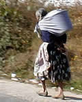 elderly woman carrying burden