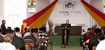 Tim speaking at conference